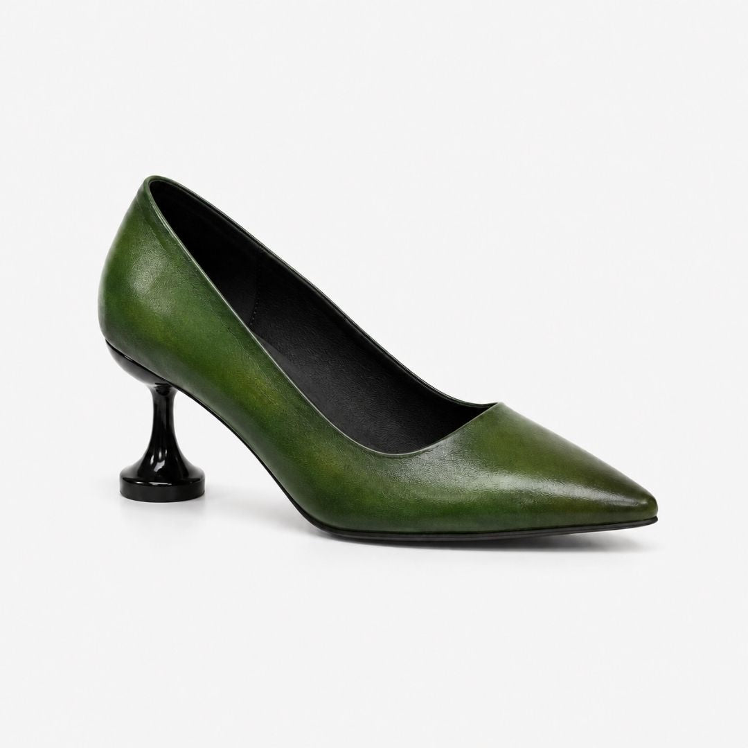 Green high-heeled shoe on a white background